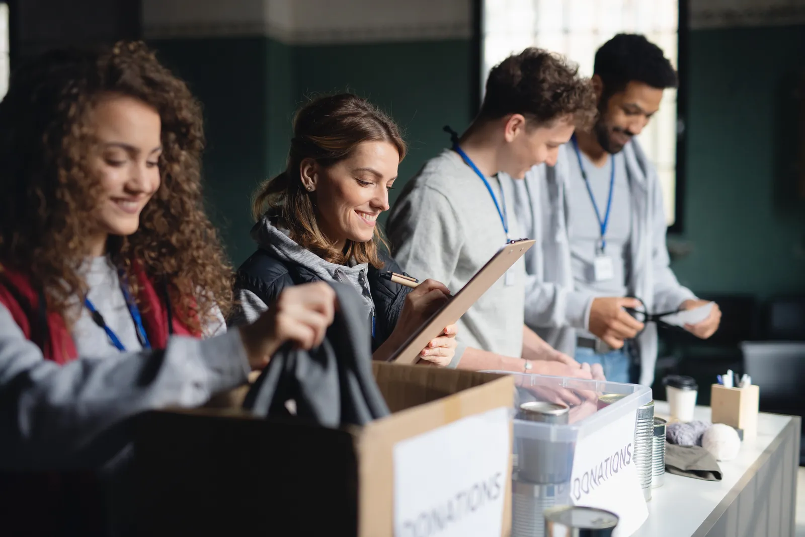 Collecting donations: volunteers sorting donated goods into boxes