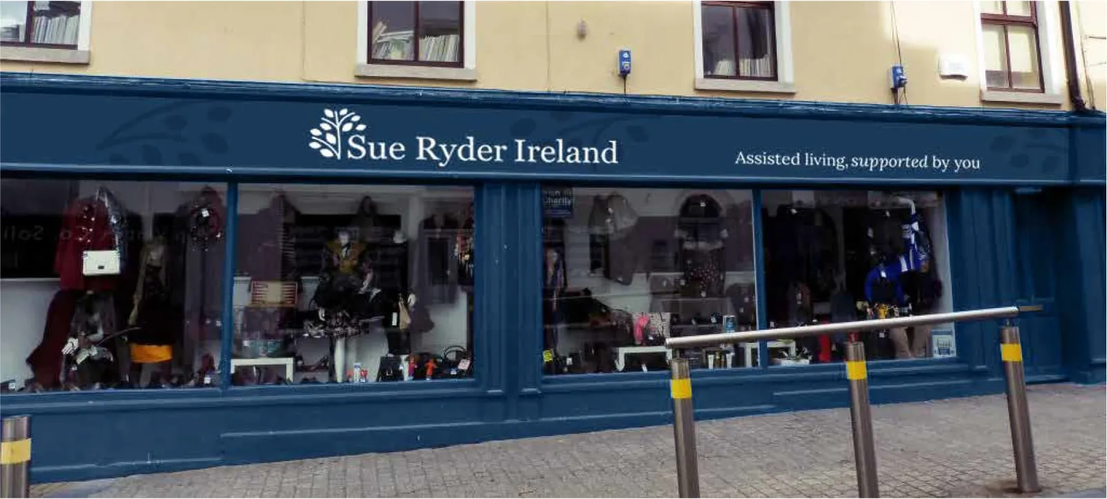 Sue Ryder Ireland charity shop front with the navy shop sign