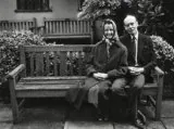 Sue Ryder on a bench with a member of the board